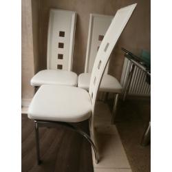 FOUR CREAM FAUX LEATHER AND CHROME DESIGNER DINING CHAIRS