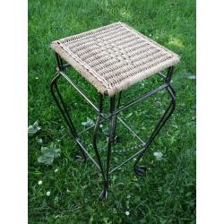 Tall wrought iron and whicker planter stand.as new condition