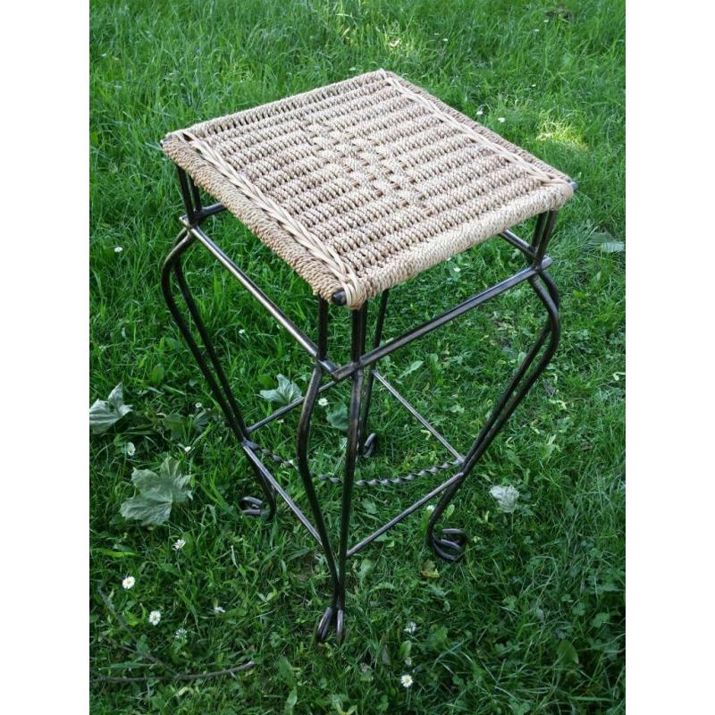 Tall wrought iron and whicker planter stand.as new condition