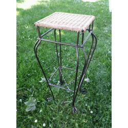 Tall wrought iron and whicker planter stand.as new condition