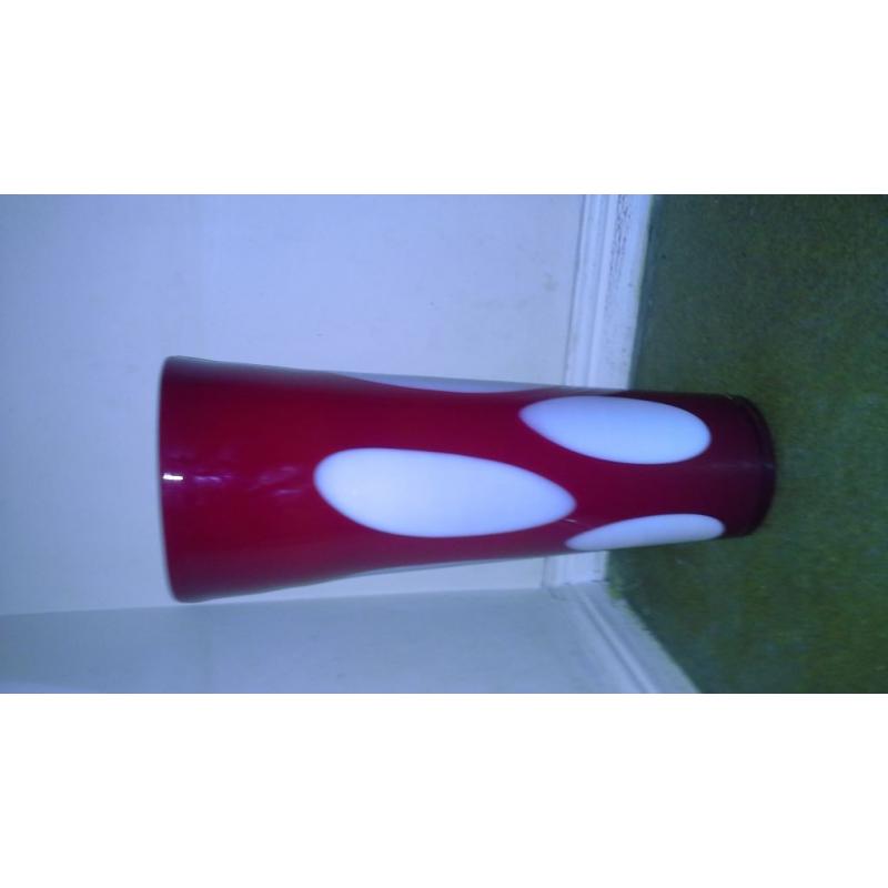 large red vase with large droplets of white