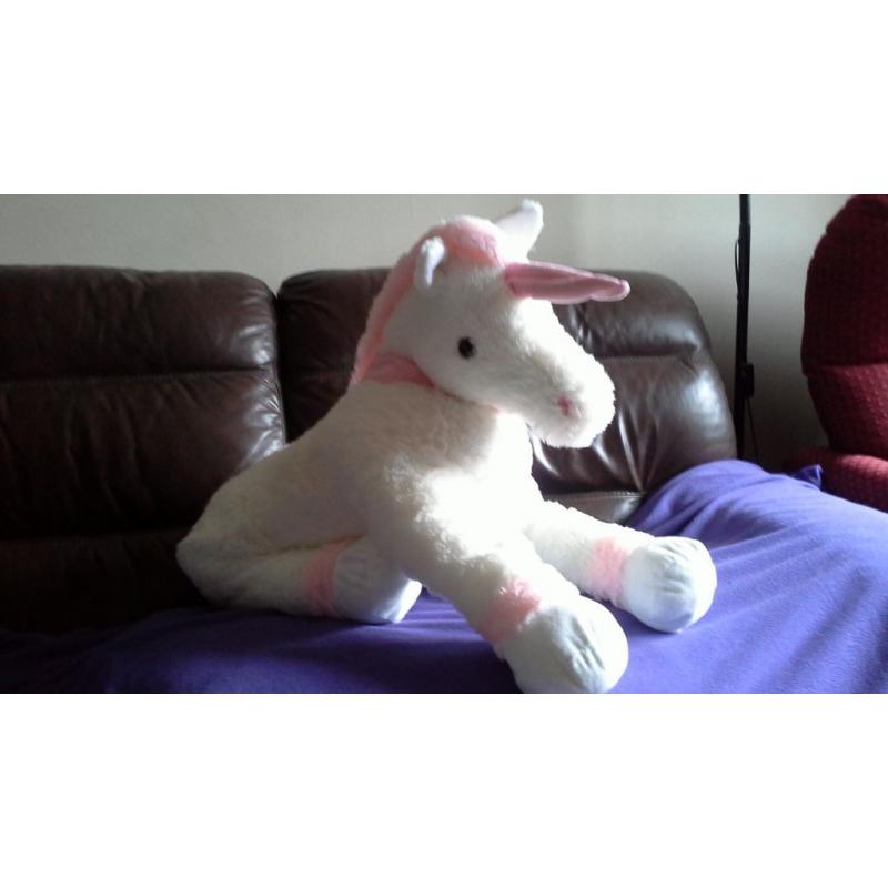 Large white Unicorn with pink ankles, horn, mane and tail. Great soft toy.