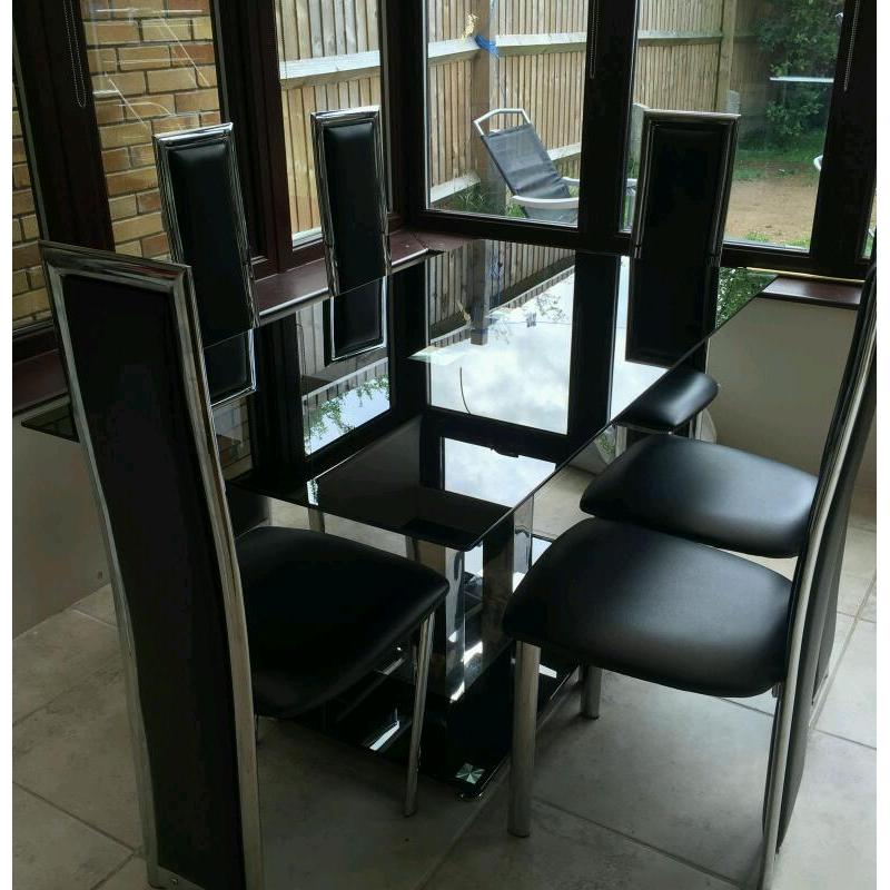 Black gloss dining table and six chairs house clearance