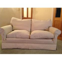 Two seater cream cotton fabric sofa