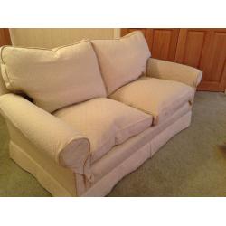 Two seater cream cotton fabric sofa