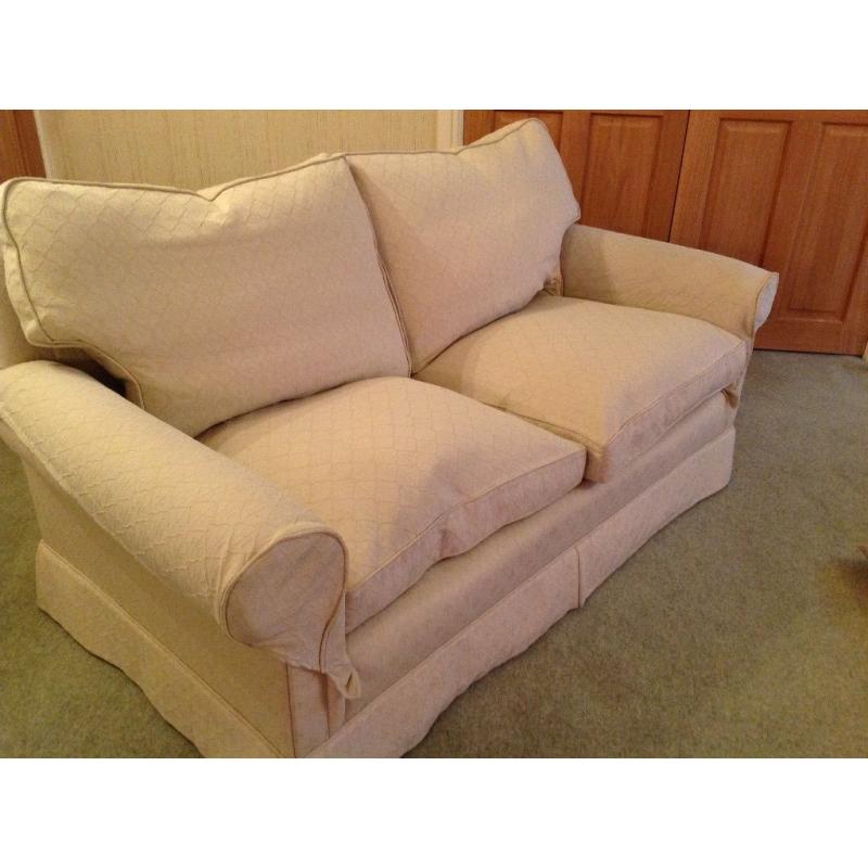 Two seater cream cotton fabric sofa