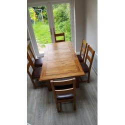 Solid oak extending table & 6 oak leather chairs