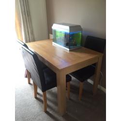 Dining room table and 4 faux brown leather chairs