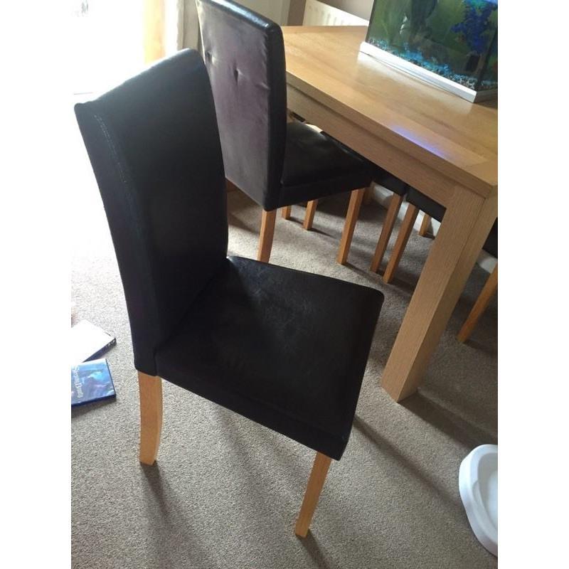 Dining room table and 4 faux brown leather chairs