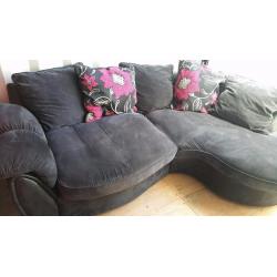 LUSH GREYISH BLACK CURVED CORNER SOFA FOR SALE.