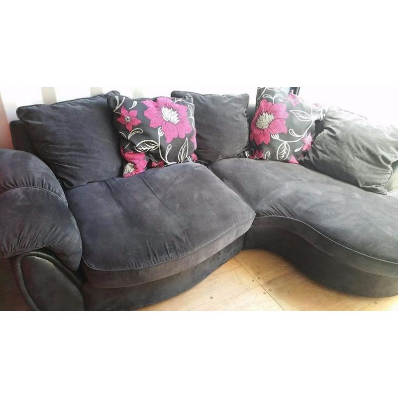 LUSH GREYISH BLACK CURVED CORNER SOFA FOR SALE.