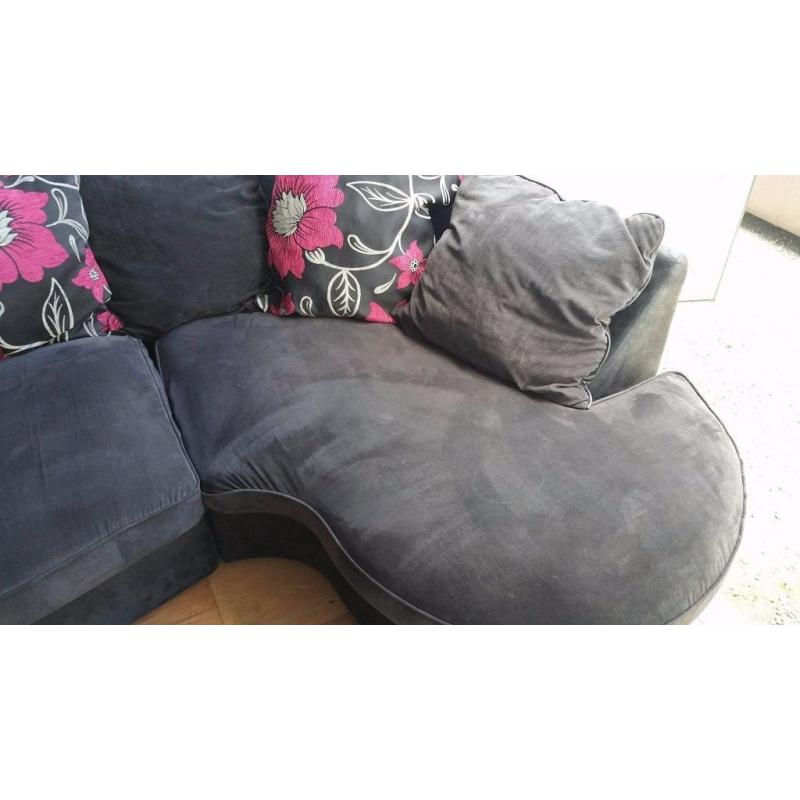 LUSH GREYISH BLACK CURVED CORNER SOFA FOR SALE.