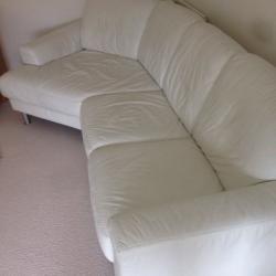 White leather corner sofa and foot rest