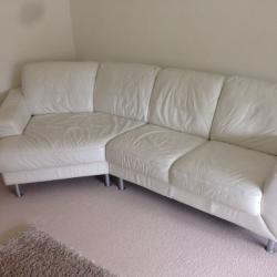 White leather corner sofa and foot rest