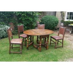 Solid oak table with 4 oak leather upholstered chairs