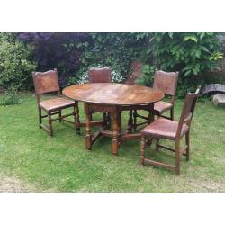 Solid oak table with 4 oak leather upholstered chairs