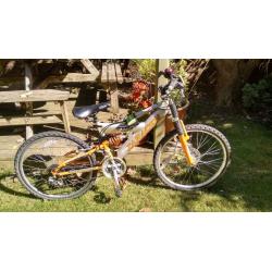 Orange Kids Saracen Mountain Bike with 14 inch frame, 24 inch wheels