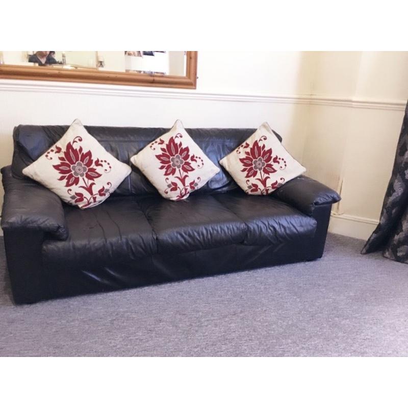 3+2 seater leather sofa and two beautiful reddish and cream febric armchairs