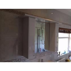 Bathroom wall cabinets and mirror plus lighting plinth in good condition