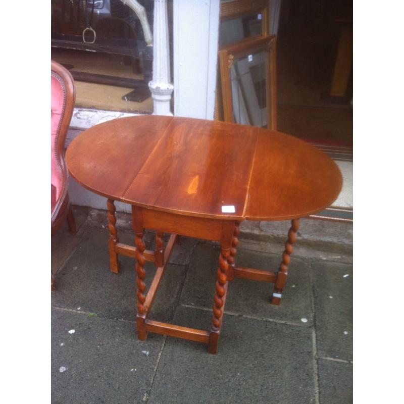 Drop Leaf table with barley twist legs , nice oval shape when up.