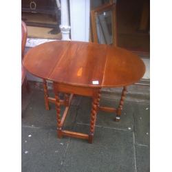 Drop Leaf table with barley twist legs , nice oval shape when up.