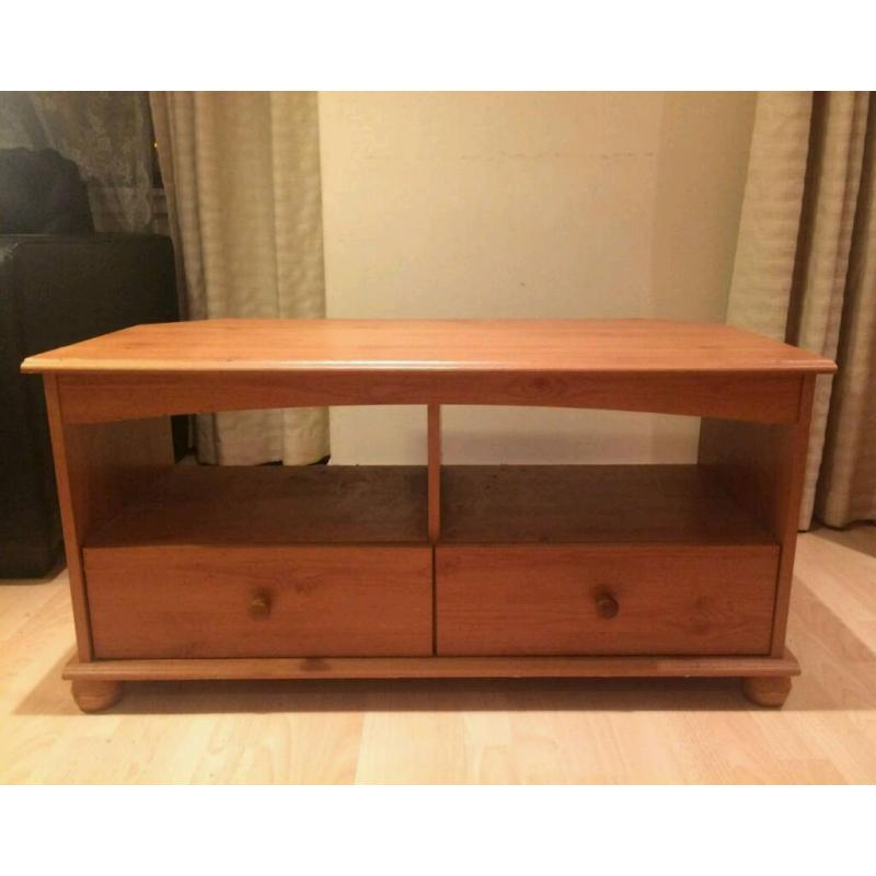 Wooden TV stand with two drawers.