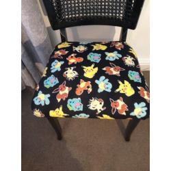 upcycled black painted chair upholstered in pokeman material